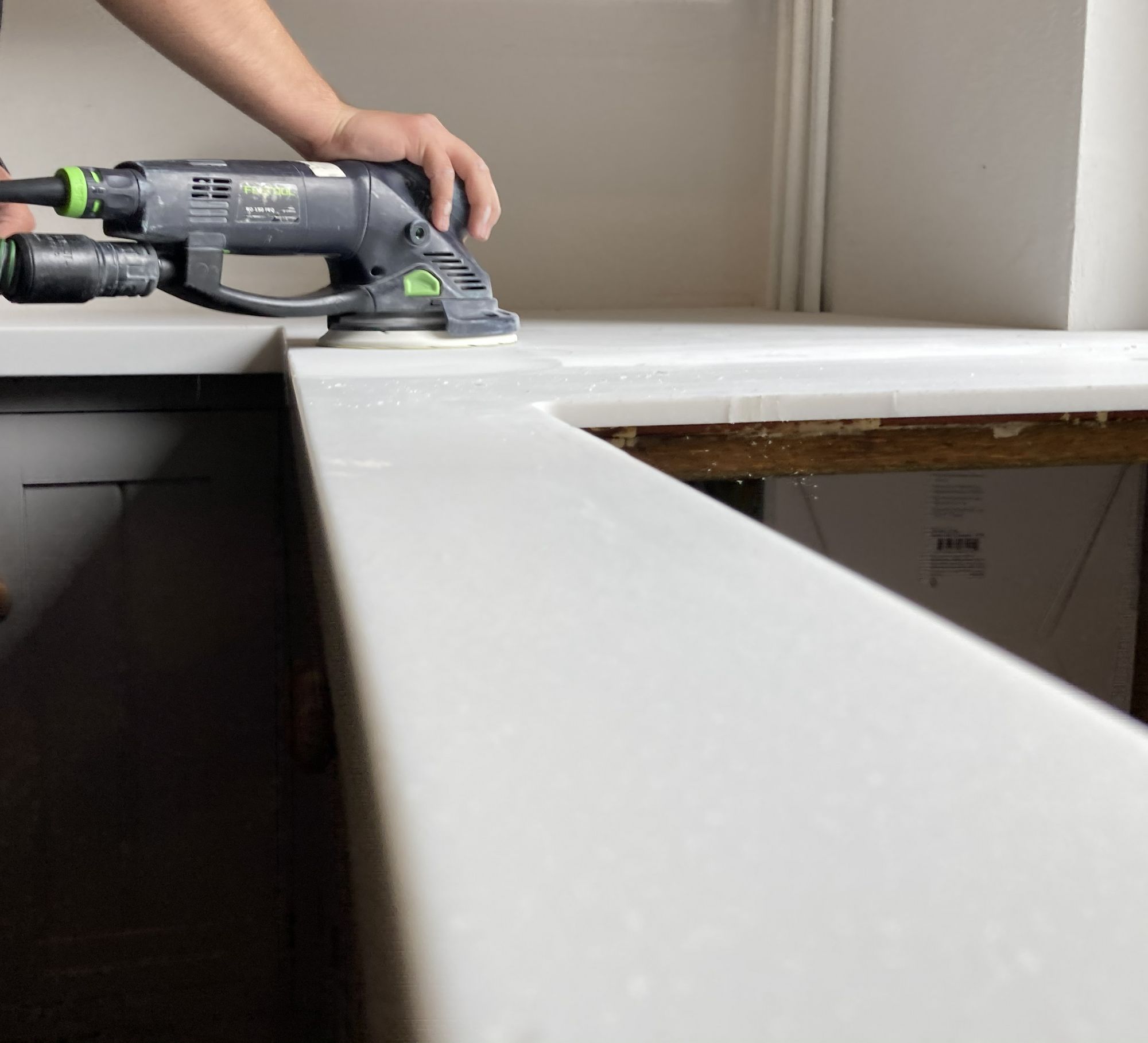 Hand-finishing a worktop edge on site